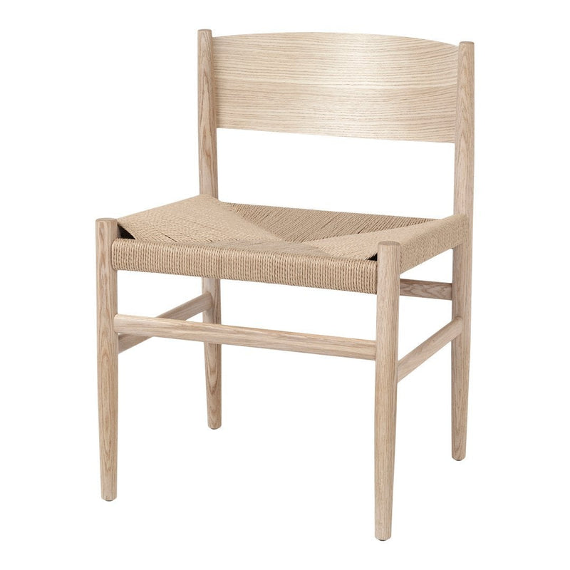 Light natural wood chair with woven beige seat, minimalist design and subtle grain patterns. Perfect for modern decor.
