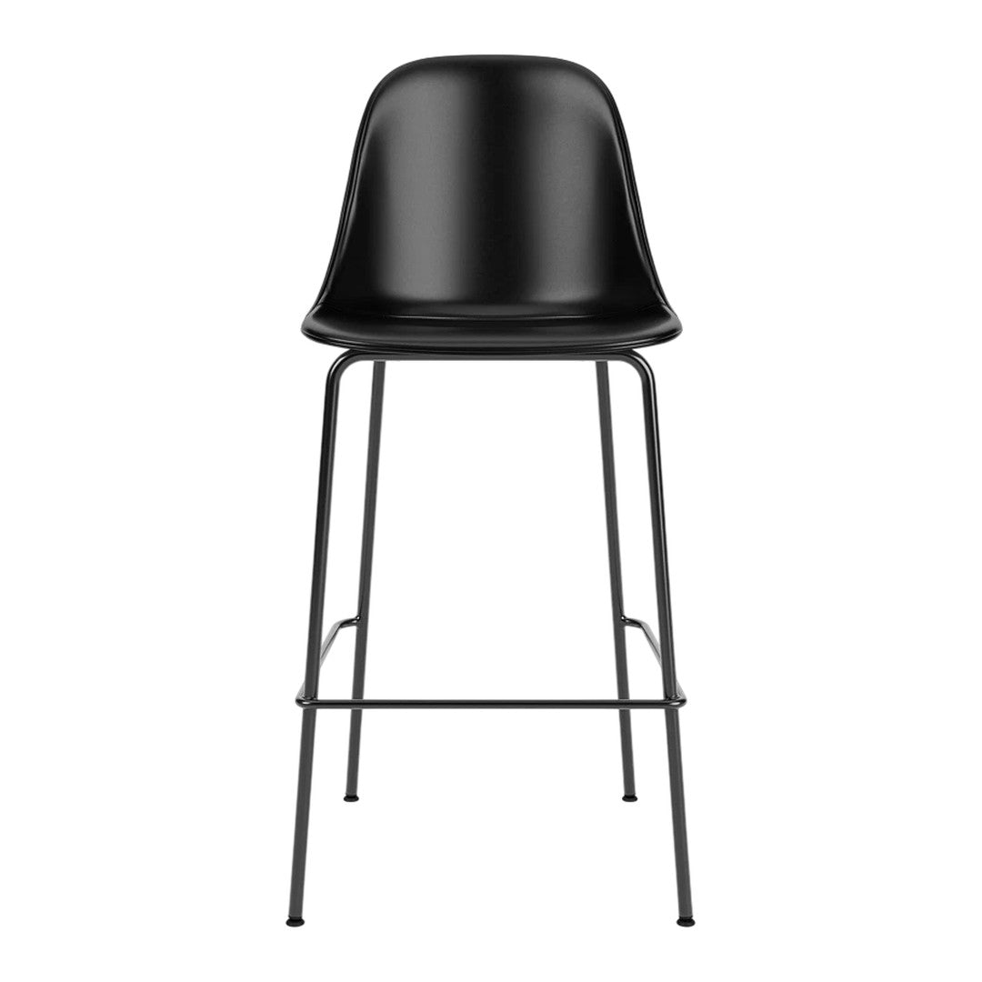 Black plastic bar stool with sleek, minimalist design and black metal legs, perfect for modern decor.