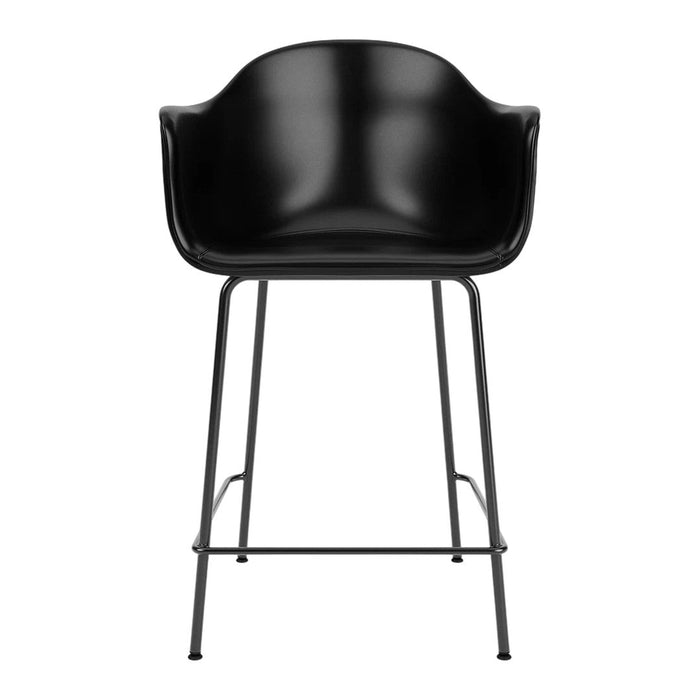 Black bar stool with a smooth, glossy finish and minimalist black metal legs. Stylish modern design for any space.