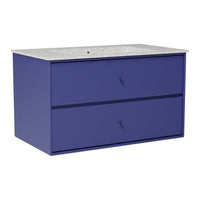 Modern blue dresser with two drawers and a speckled countertop, adding a stylish pop of color and texture to any room.