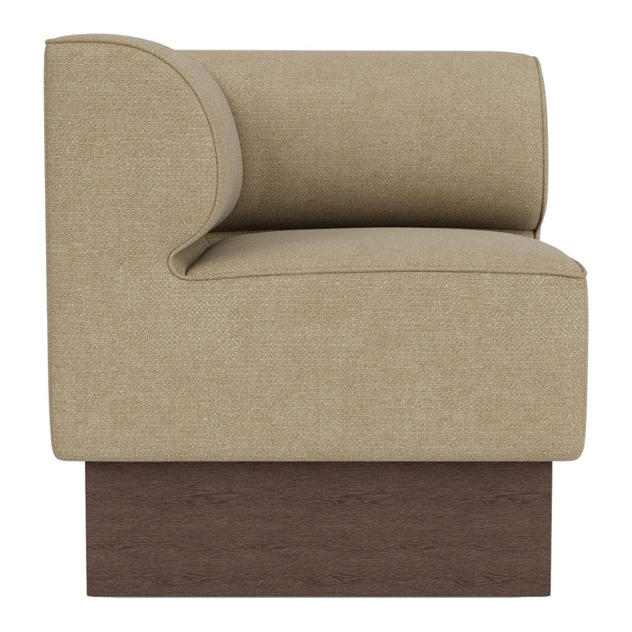 Beige upholstered armchair with curved backrest and dark wooden base, showcasing a smooth, minimalist design.