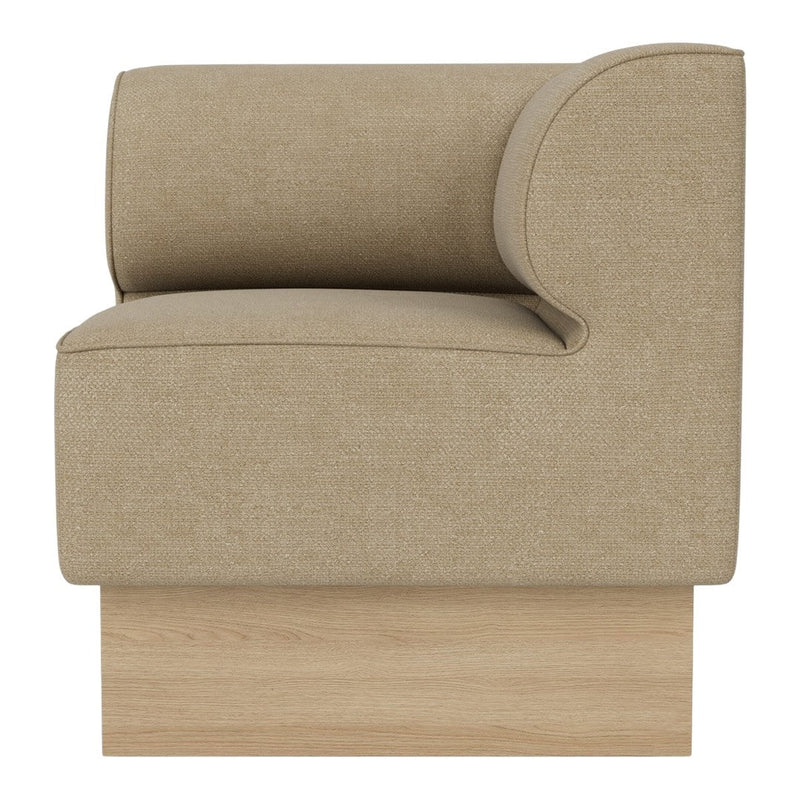 Beige upholstered chair with a smooth texture and rounded arm, balanced on a light wood base.