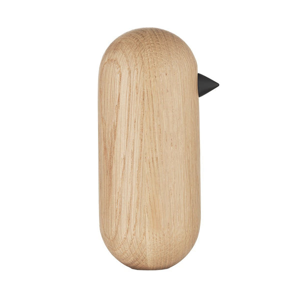 Light oak wooden bird figurine with a smooth, rounded shape and a sleek black beak. Simple, natural design.