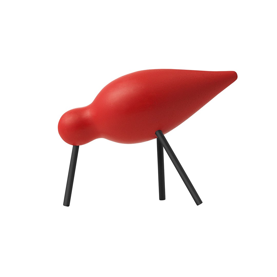 Red bird figurine with a smooth, rounded body and sleek black legs, perfect for modern decor.