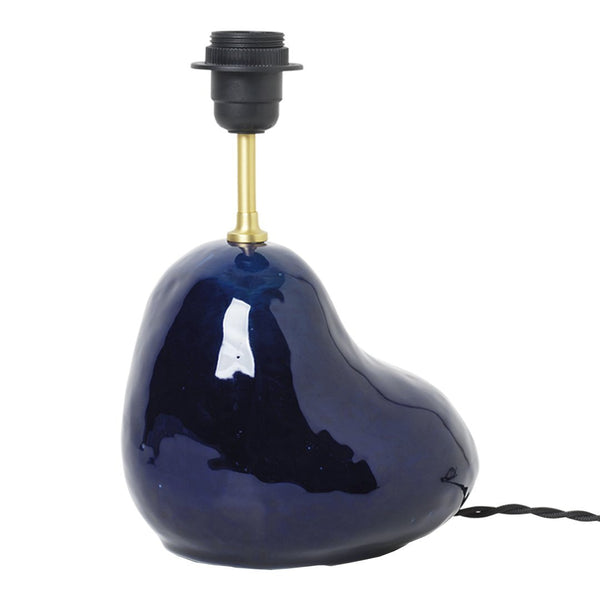 Navy blue ceramic lamp base with a glossy finish and organic, rounded shape. Elegant brass socket for a chic touch.