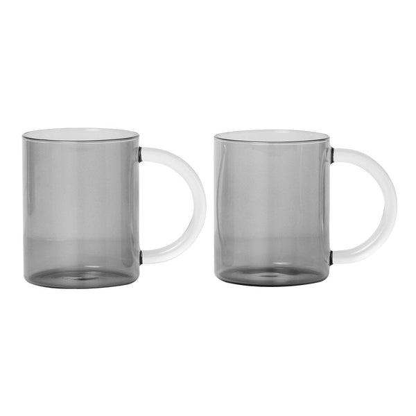 Set of two transparent gray mugs with clear handles, featuring a modern, minimalistic design.