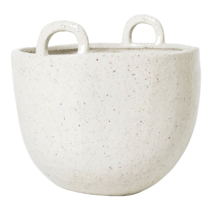 Textured off-white planter with subtle speckling and unique handle design. Ideal for modern decor.