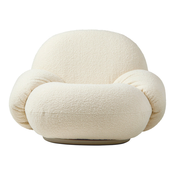 Cream textured swivel chair with soft, rounded shapes for a cozy, modern aesthetic.