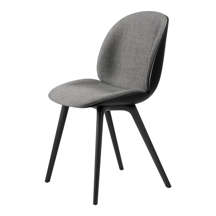 Gray upholstered chair with a smooth, minimalist design and black wooden legs, perfect for modern interiors.