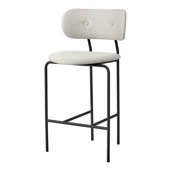 Light gray upholstered stool with a minimalist design and black metal frame. Simple, elegant, modern pattern.