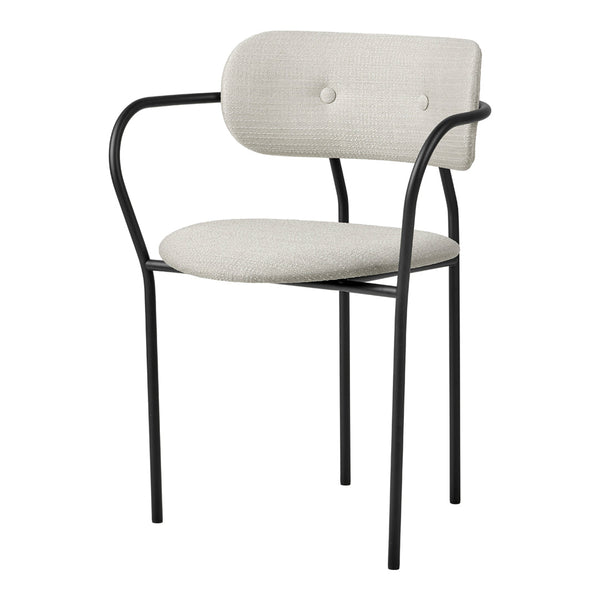 Stylish chair with a soft beige upholstery and sleek black metal frame, featuring a minimalist design and subtle button detail.