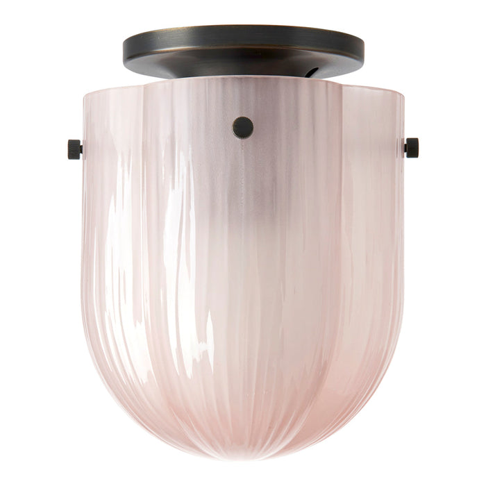 Blush pink ribbed glass flush mount ceiling light with a black metal canopy. Elegant and modern design.