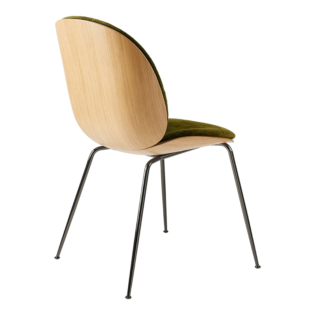 Wooden chair with a curved back, olive green velvet seat, and sleek black metal legs. Modern design with natural tones.