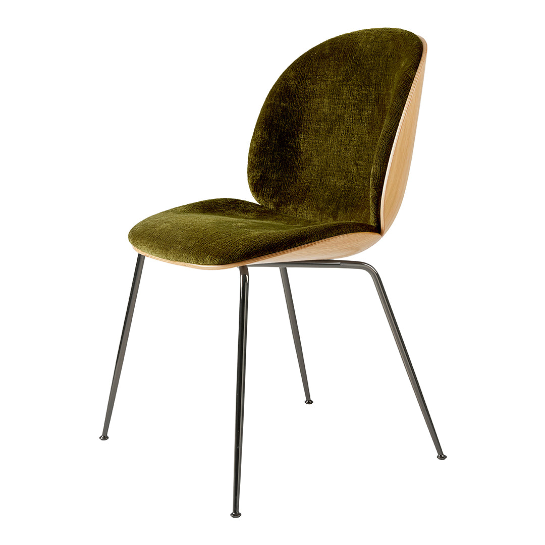 Green velvet upholstered chair with a smooth wood backrest and sleek black metal legs. Modern and stylish design.