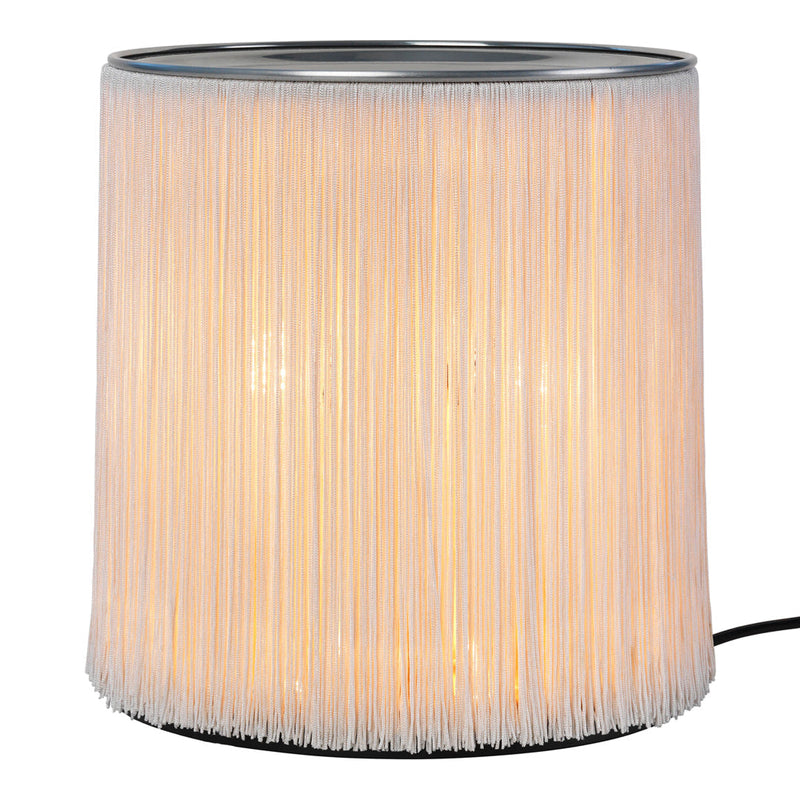 Translucent white fringe lamp with a soft glow, featuring a sleek silver top and minimalist design. Perfect for modern decor.