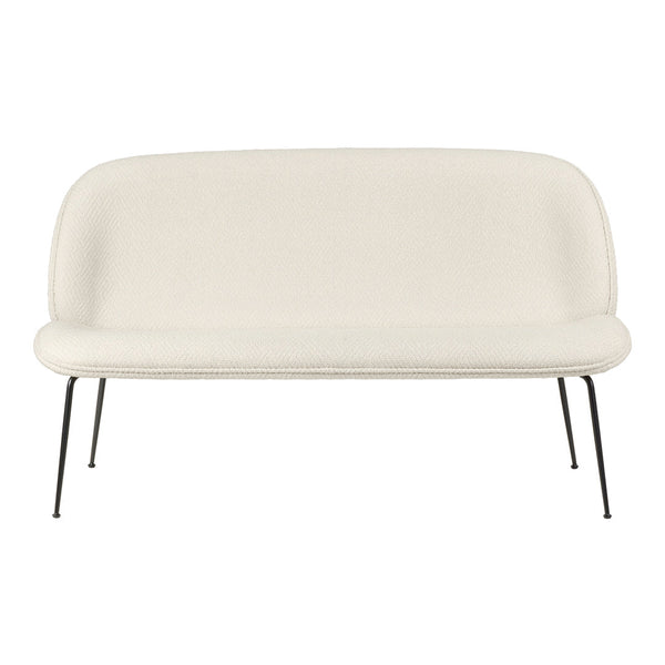 Cream-colored fabric sofa with a smooth, minimalist design and sleek black metal legs. Ideal for modern decor.