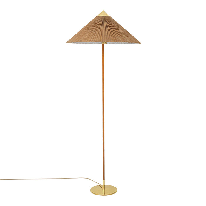 Tall floor lamp with a conical beige shade and a sleek gold base, offering a modern minimalist design.