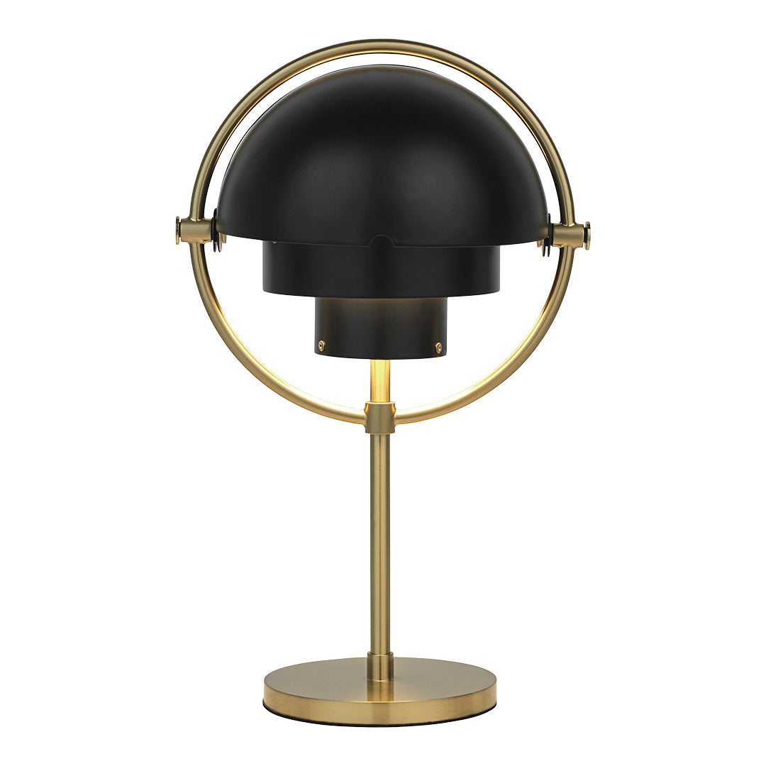 Black dome lamp with a sleek brass base and circular accents, adding a modern touch to any décor.