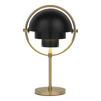 Black dome lamp with a sleek brass base and circular accents, adding a modern touch to any décor.