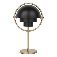 Black and gold lamp featuring a smooth dome shade and a circular base design. Ideal for modern decor.