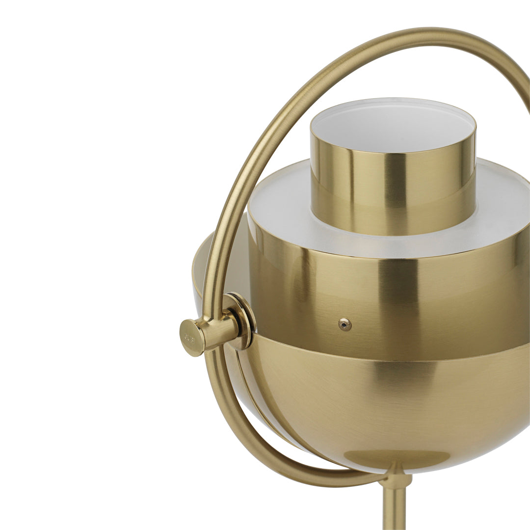 Brushed gold lamp with a sleek white shade and minimalist design, featuring a circular pattern and elegant curves.