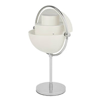 Modern white lamp with sleek chrome accents and a layered, oval design. Minimalist decor piece for any room.