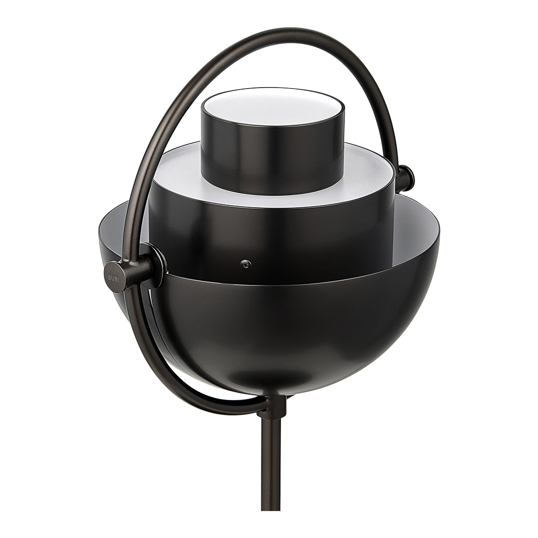 Modern black metal lamp with a sleek rounded design and white accents, featuring a minimalist geometric pattern.