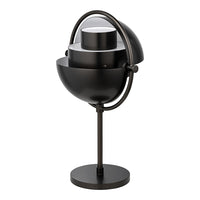 Modern black table lamp with geometric layers and a sleek, minimalist design. Perfect for contemporary interiors.