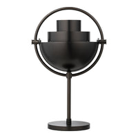 Sleek black lamp with a circular base and layered geometric design. Matte finish adds a modern touch to any decor.