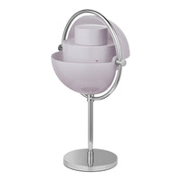 Modern lamp in soft lavender with sleek chrome accents and a minimalist spherical design. Perfect for contemporary decor.