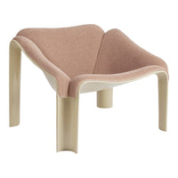 Stylish chair in soft pink upholstery with a smooth cream base, featuring a modern, minimalist design.
