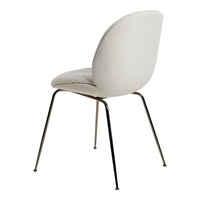 Stylish white upholstered chair with a smooth, minimalist design and sleek metal legs. Ideal for modern spaces.