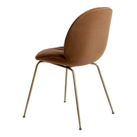 Brown velvet chair with a smooth texture and sleek metal legs, featuring a minimalist design.