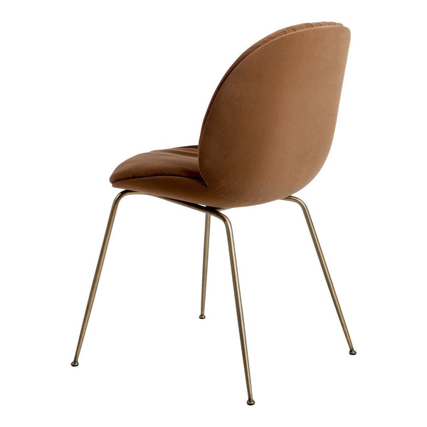 Brown velvet chair with a smooth texture and sleek metal legs, featuring a minimalist design.