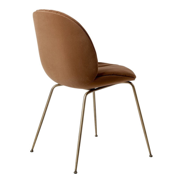 Sleek brown velvet chair with a smooth finish and gold metal legs, featuring a minimalist design. Perfect for modern decor.
