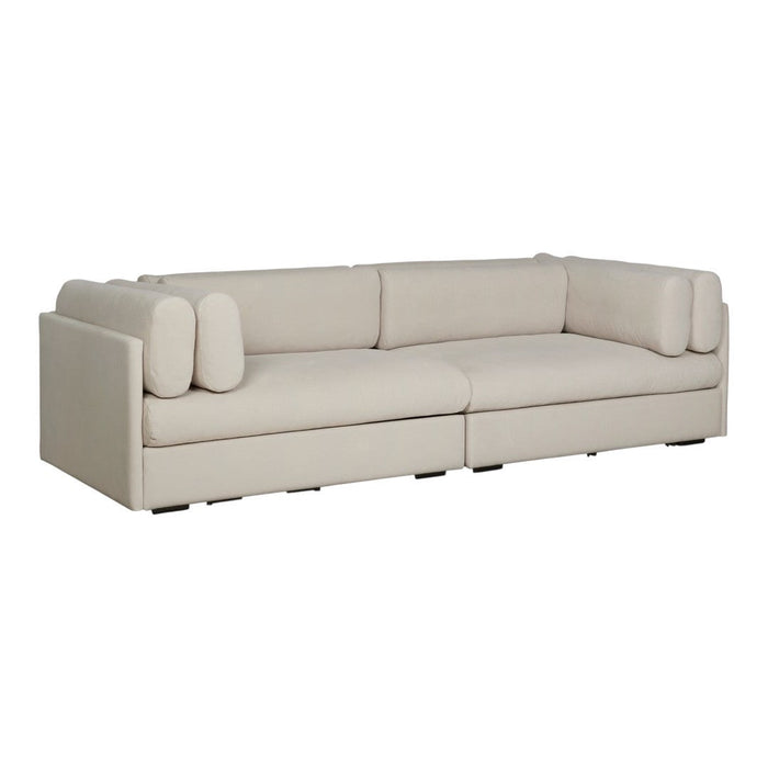 Beige sectional sofa with rounded cushions, featuring a sleek, minimalist design. Ideal for modern interiors.