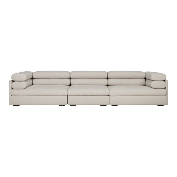 Elegant light beige sectional sofa with smooth, minimalist design and plush cushions for a modern living space.