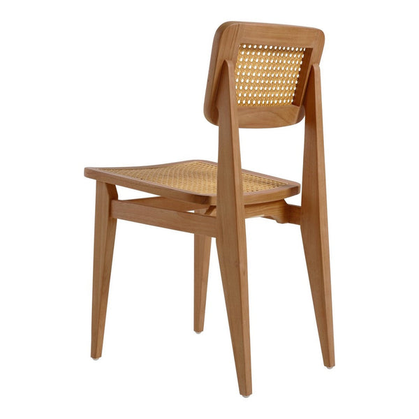 Wooden chair in natural light brown with a woven cane backrest and minimalist design, showcasing clean lines and a classic look.