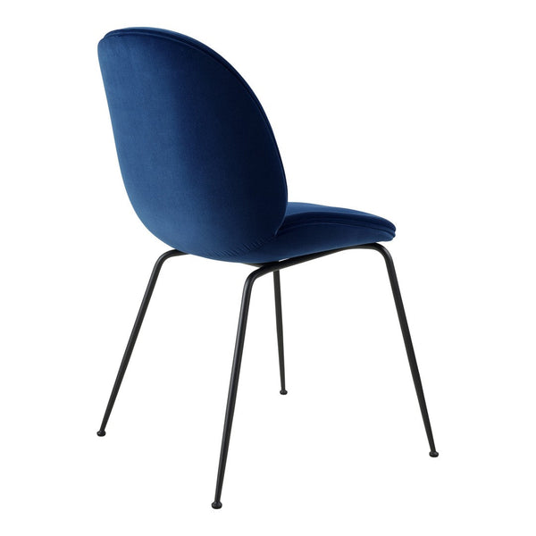 Blue velvet chair with a sleek, modern design and black metal legs. Perfect for stylish home decor.