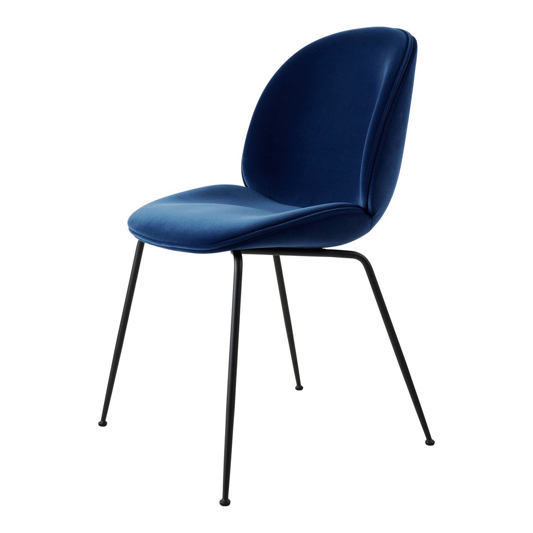 Navy blue velvet chair with a smooth finish and minimalistic black metal legs. Perfect for modern decor.