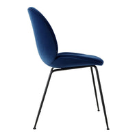 “Elegant blue velvet chair with smooth contour and sleek black metal legs.”