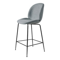 Stylish gray upholstered bar stool with a sleek black metal frame, featuring a smooth, curved design.