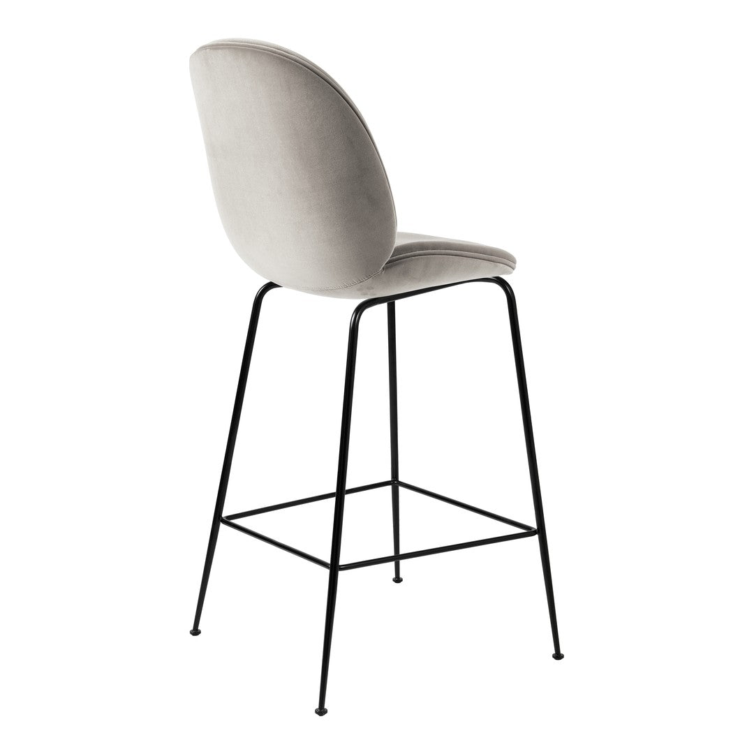 Stylish bar stool in soft gray upholstery with a sleek black metal frame. Perfect for modern interiors.