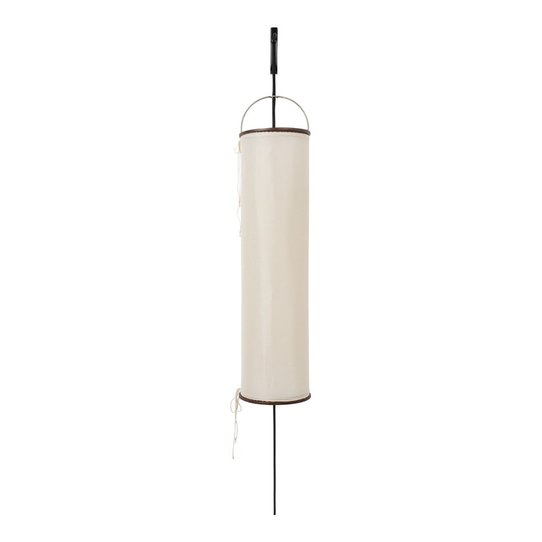 Cream cylindrical lantern with black accents, featuring a minimalist design and a smooth fabric pattern.