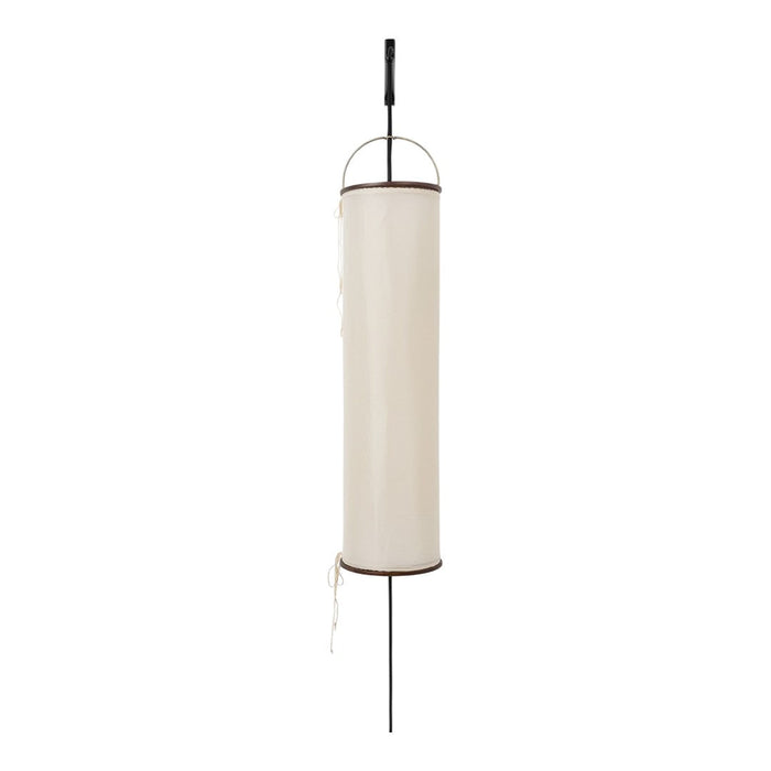 Cream cylindrical lantern with black accents, featuring a minimalist design and a smooth fabric pattern.