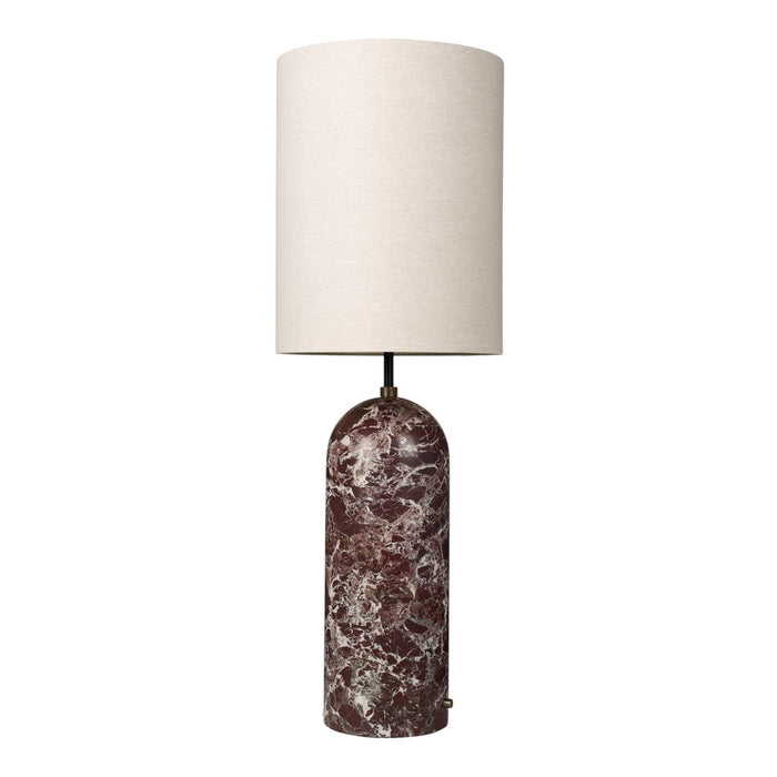 Brown marble lamp base with a textured finish and a plain white fabric shade. Elegant and modern design.