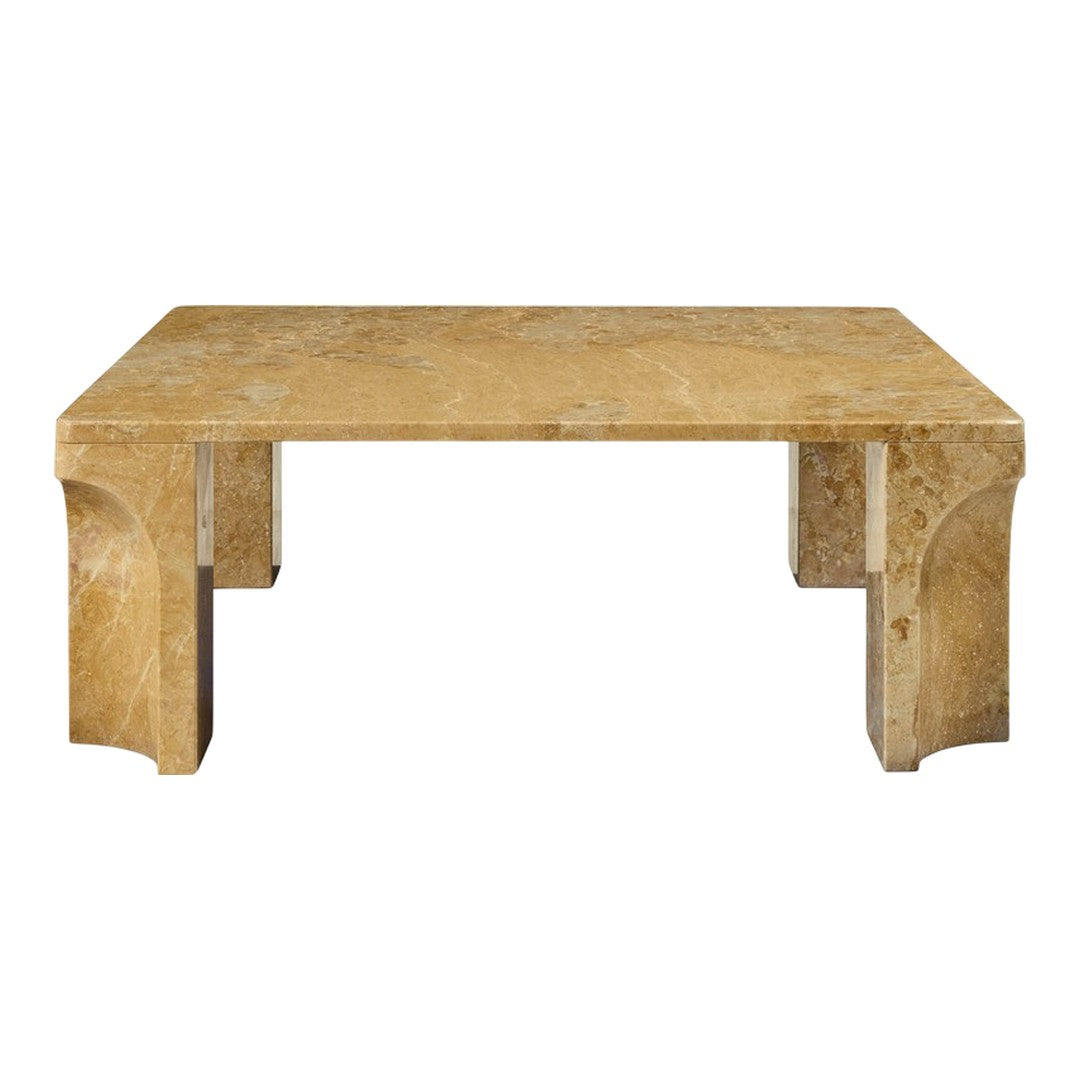 Beige marble coffee table with a smooth, polished surface and geometric patterns. Elegant and modern design element.