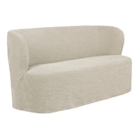 Curved beige sofa with a smooth, textured fabric in a minimalistic design, perfect for modern decor.