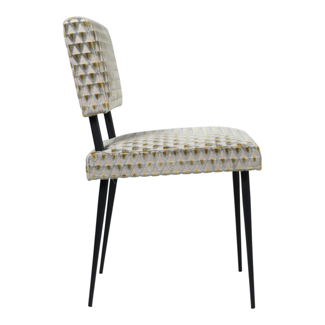 Elegant cream chair with a geometric pattern and muted gold accents, complemented by sleek black metal legs.