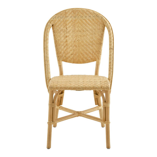 Natural rattan chair featuring a woven texture in light beige with a curved back and sturdy legs.